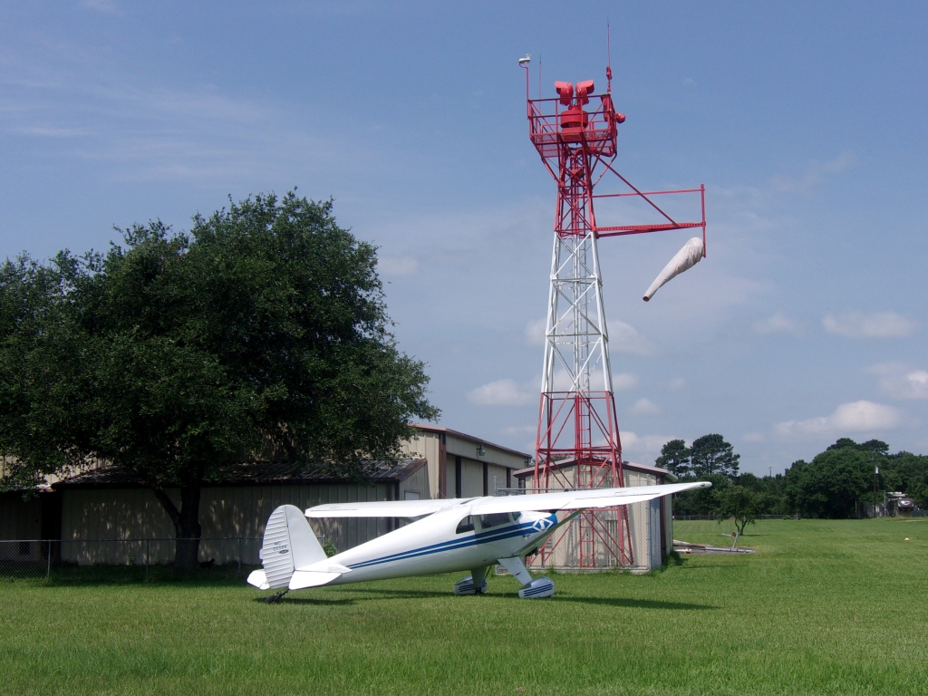 Harvey's 1947 Luscombe Model 8A “Silvaire” provides perspective as to the size and scope of his tower's restoration project.<br>The 2-seat sportplane has a 35ft wingspan and a 6ft height.